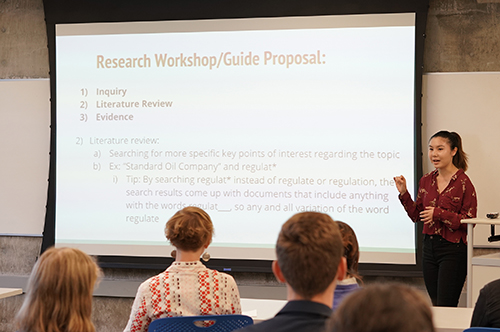 Undergraduate Library Fellow Caitlin Cozine, left, presents her research with Kristina Smelser, at the Undergraduate Library Fellows showcase on May 1, 2018. Their research focuses on students using the reference desk at Doe Library. (Photo by Cade Johnson for the UC Berkeley Library)